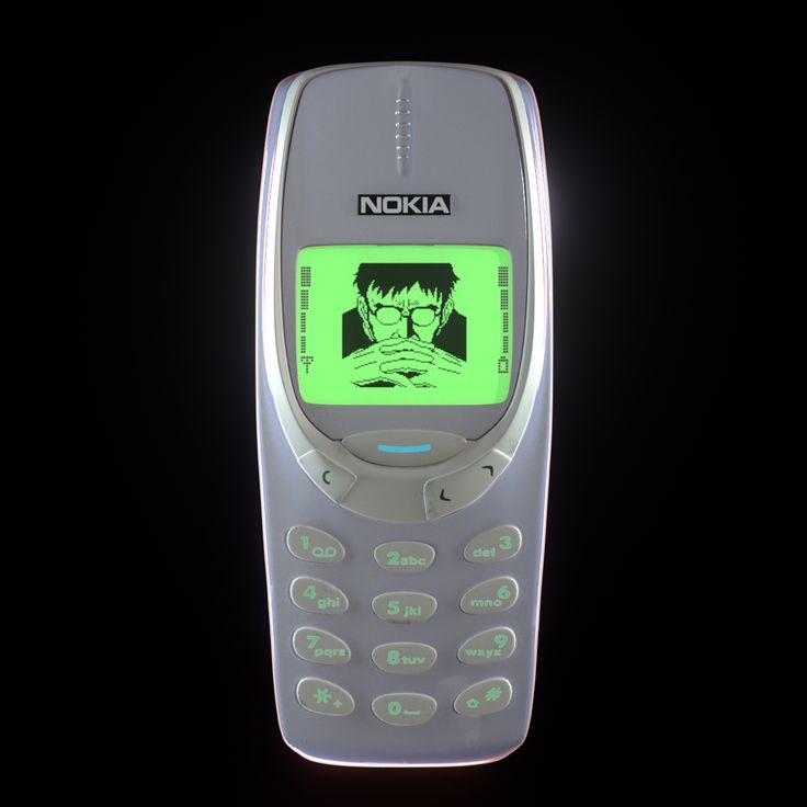 an old nokia cell phone with the image of harry potter on it's screen