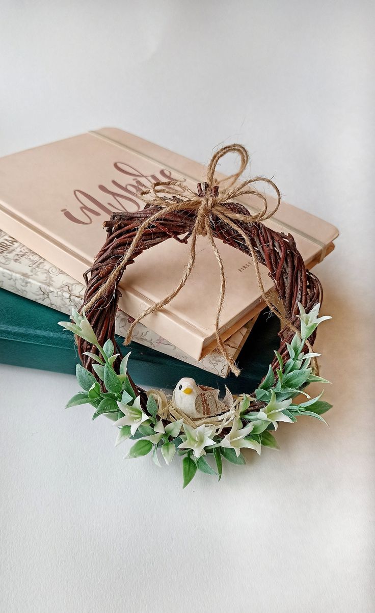 a book with a wreath on top of it