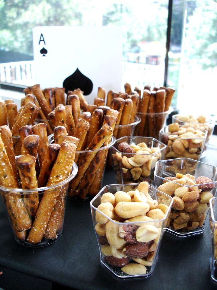 several cups filled with different types of snacks