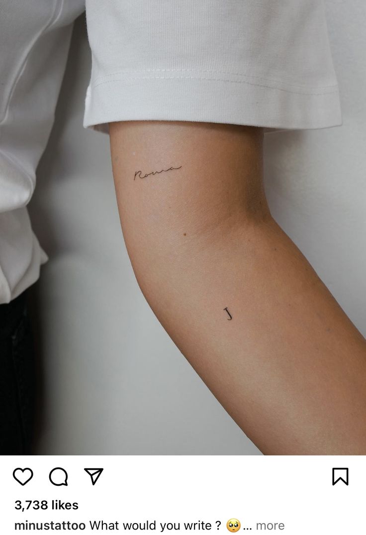 a person with a small tattoo on their arm