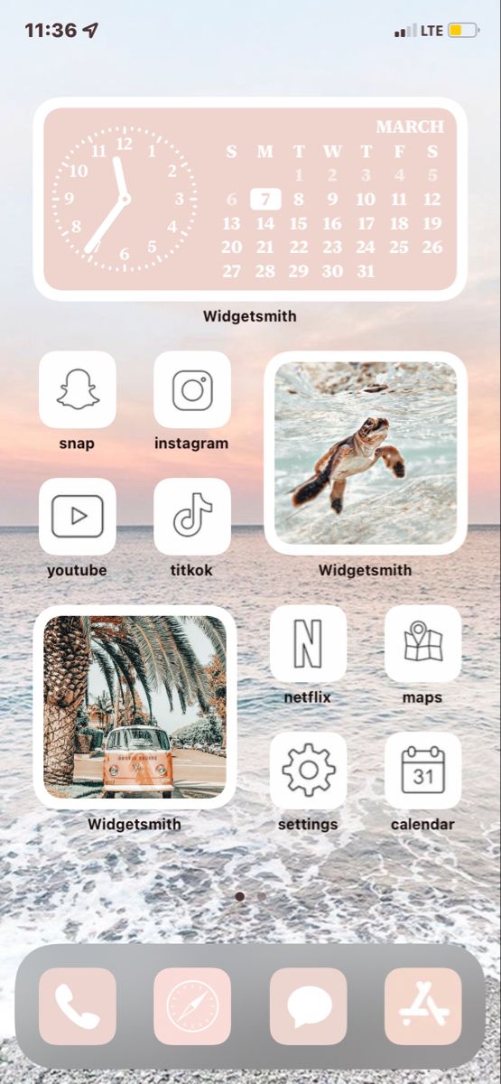 an iphone screen with icons on it and the ocean in the backgroung