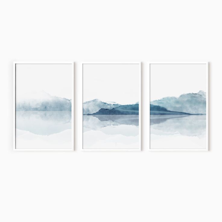 three watercolor paintings hanging on the wall