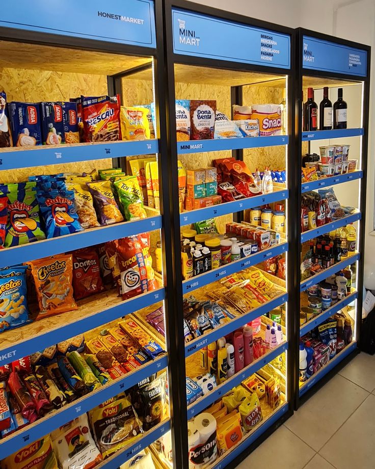 two vending machines filled with lots of food and drinks in front of each other