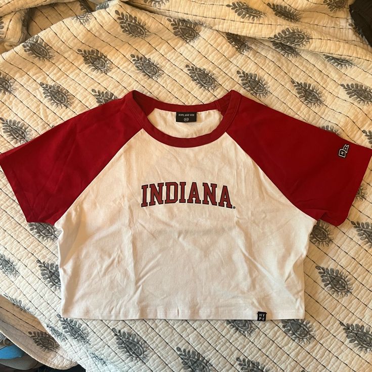 Brand New Worn Once Perfect Condition! College Style Short Sleeve Tops For Game Day, Red Sporty Tops For College, Sporty Red Tops For College, Casual Cotton Crop Top For College, Casual Cotton Crop Top, Red Graphic Tee Cropped T-shirt, Red Varsity Streetwear Top, Red Varsity Top For Streetwear, Red Cropped Cotton T-shirt Casual