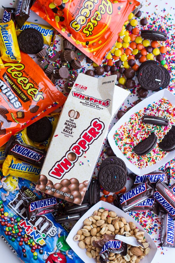 an assortment of candy and snacks on a table