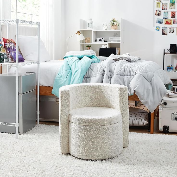 a bedroom with a bed, chair and desk