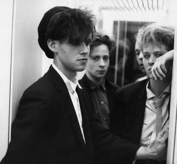 black and white photograph of young men in suits