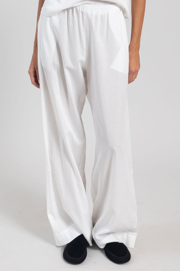 Please note this item is available for pre-order only at this time. Estimated shipping: Late May. Breeze into summer. Our bestselling Yoko Pocket Pant returns: Cut in 100%, crisp cotton lawn, this wear-anywhere pant features a comfortable elasticized waistband, side seam pockets, the perfect relaxed fit. White Relaxed Bottoms With Side Pockets, White Cotton Pants With Patch Pockets, White Relaxed Fit Pants With Side Pockets, White Wide-leg Pants With Pockets, White Full-length Pants With Side Pockets, Button Down Dress, Pocket Pants, Crop Tank, Kendall Jenner