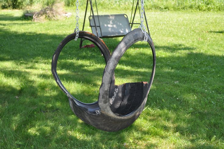 an empty swing chair in the grass