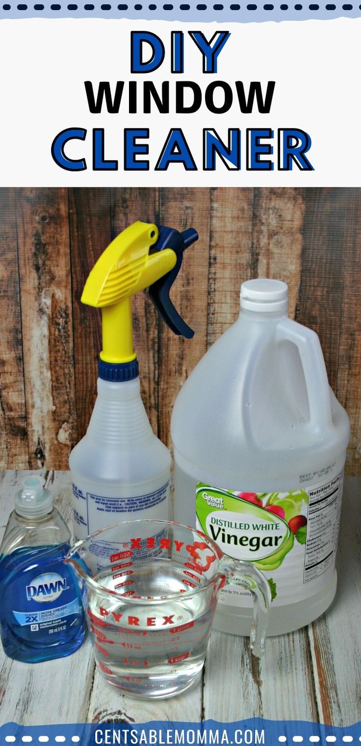 diy window cleaner and other cleaning supplies on a wooden table with text overlay