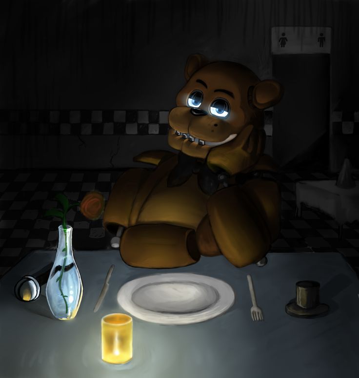 a teddy bear sitting at a dinner table