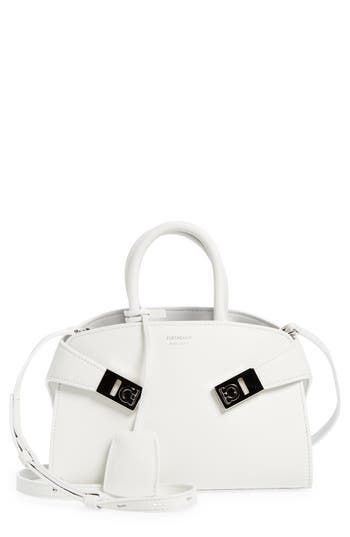 Extended tabs secured with Gancio flip-locks appear to embrace this retro-inspired satchel crafted of calfskin leather in an accordioned silhouette. Bridge-toggle closure Top carry handles; removable, adjustable shoulder strap Removable key ring Two interior card slots Leather/textile Structured silhouette with flat base for stability Made in Italy Designer Handbags White Leather Satchel With Metal Hardware, White Satchel With Silver-tone Hardware For Office, Designer White Satchel With Palladium Hardware, White Office Satchel With Silver-tone Hardware, Luxury White Satchel With Metal Hardware, Modern White Satchel With Palladium Hardware, Formal White Satchel With Palladium Hardware, White Satchel With Palladium Hardware And Top Handle, White Top Handle Satchel With Palladium Hardware