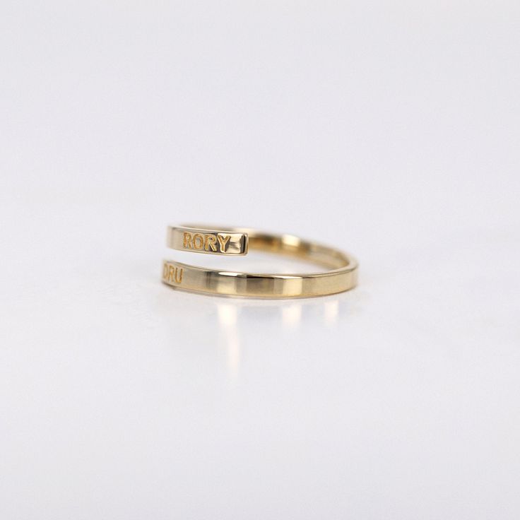 Name Ring, Initial Ring, Personalized Ring, Bypass Ring, Flat Twist Ring Band, Personalized Engraving Flat Ring, Wedding Ring, 14k Gold Ring ≫ Product Details ◈ Handmade / Handcrafted Fine Jewelry ◈ Ring Width: 2.40mm ◈ Thickness: 1.3 mm ◈ Metal: Solid 14K Gold ◈ Gold Color: White gold, Rose gold, Yellow gold ≫ Please read our FAQ below for more detail. Twist Ring Band, Ring Initial, Flat Ring, Twisted Band Ring, Name Ring, Flat Twist, Name Rings, Personalized Ring, Bypass Ring