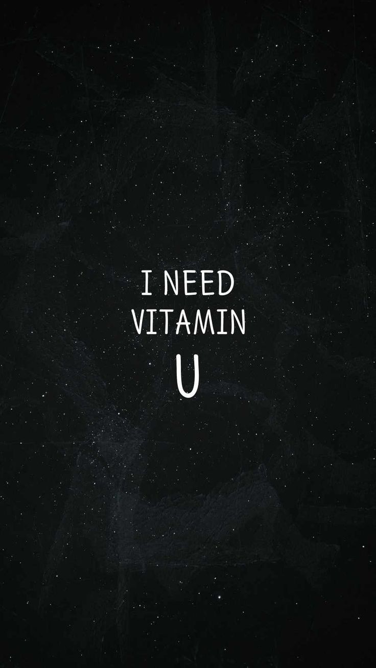 the words i need vitamin u written in white on a black background with small speckles