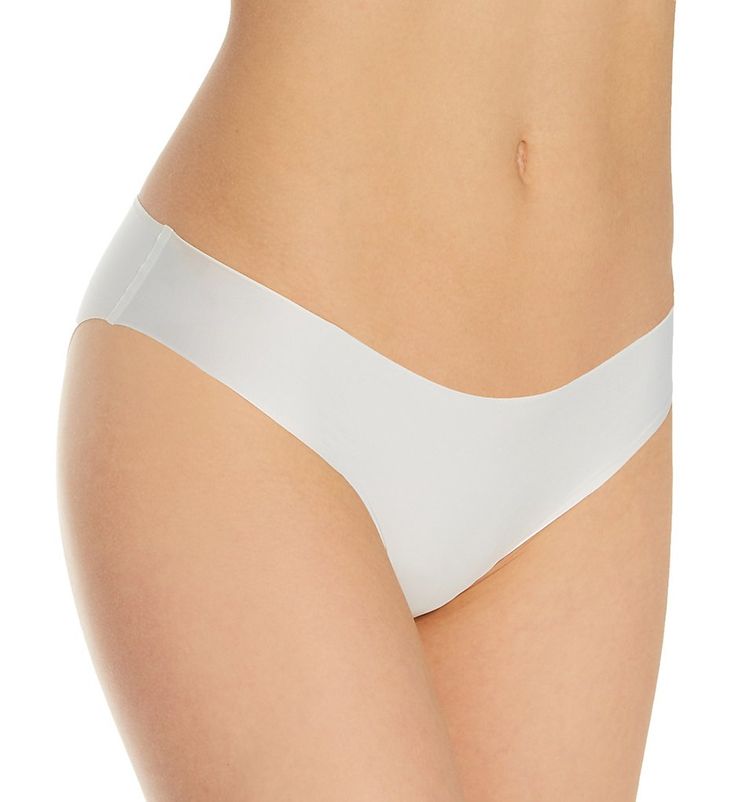 An ethereally light panty that is sure to become an everyday favorite. Made of nylon/cotton/elastane. Waist edge and leg openings have absolutely nothing sewn on to show under clothes. Silky microfiber knit feels heavenly soft against your skin. Sides are bonded. Four-way stretch moves any way you do. Low rise. Cheeky, seamless rear coverage. Tagless to help prevent irritation. Fully lined with bonded cotton crotch. Simone Perele Women's Uniq Bikini Panty in Ivory (10V720) | Size XL | HerRoom.co Simone Perele, Low Rise, Size Medium