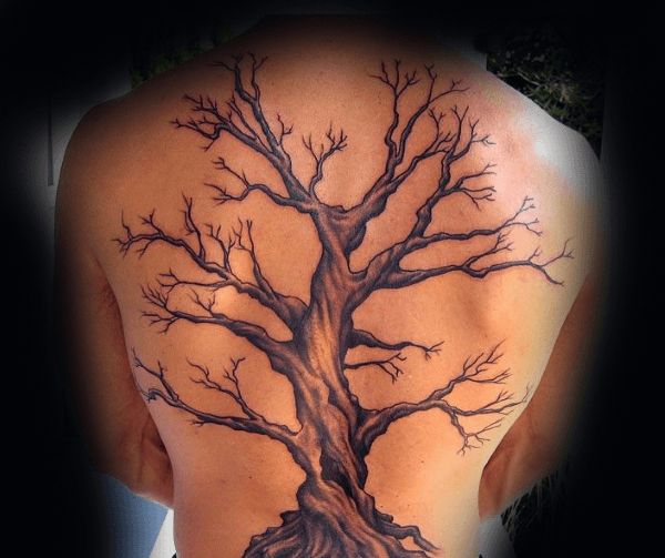 a man with a tree tattoo on his back