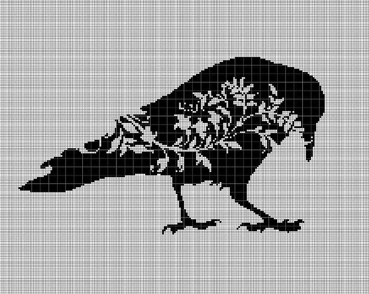 a black and white bird with flowers on it's head is shown in the cross stitch pattern