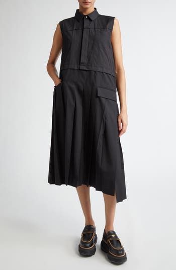 Chitose Abe's signature blend of opposing aesthetics shines in the suiting-inspired pleated skirt and contrasted utility-style bodice of this sleeveless midi. Hidden-button half placket Spread collar Sleeveless Chest patch pocket; front flap pockets Cotton/polyester Dry clean Made in Japan Designer Clothing Asian & Pacific Islander Owned/Founded Sleeveless Pleated Dress With Box Pleat For Summer, Sleeveless Box Pleat Pleated Dress For Summer, Workwear Sleeveless Midi Dress With Pleated Bodice, Sleeveless Midi Dress With Pleated Hem For Work, Summer Workwear Pleated Dress With Box Pleat, Chic Sleeveless Work Dress With Pockets, Sleeveless Pleated Dress For Work, Chic Sleeveless Dress With Pleated Waist For Work, Sleeveless Summer Dress With Pleated Bodice For Work