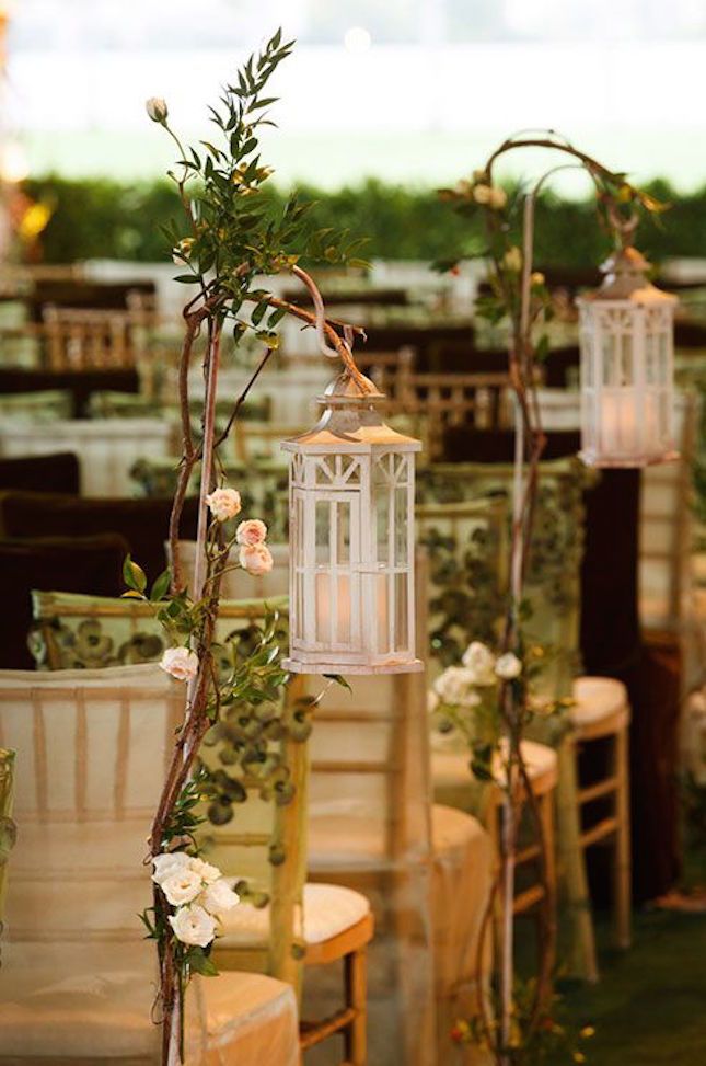 an image of a table setting with flowers and candles on the tables in front of them