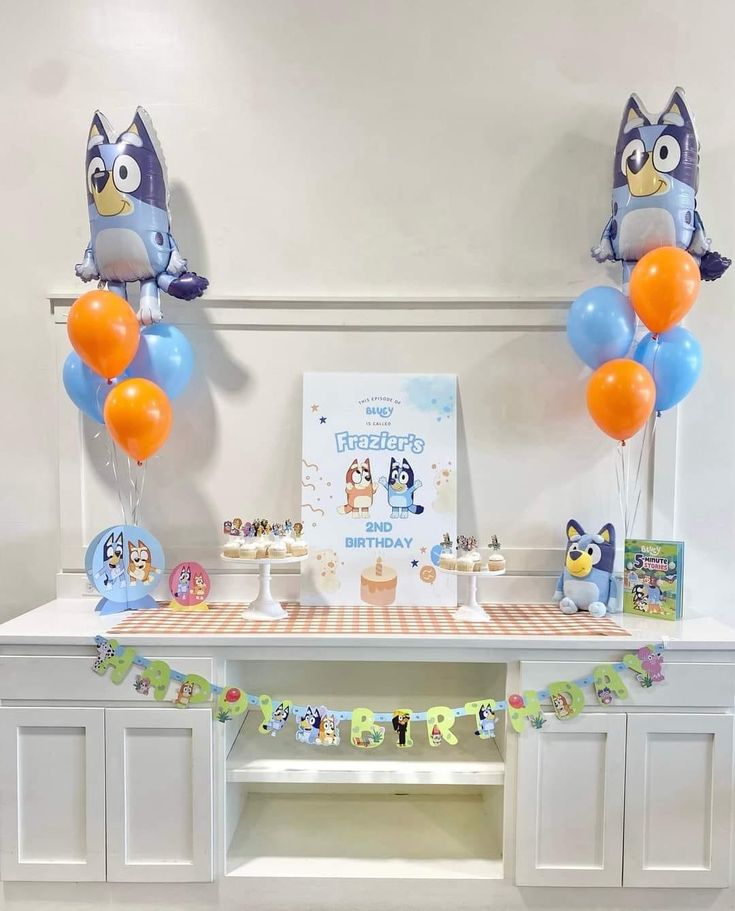 an owl themed birthday party with balloons and decorations