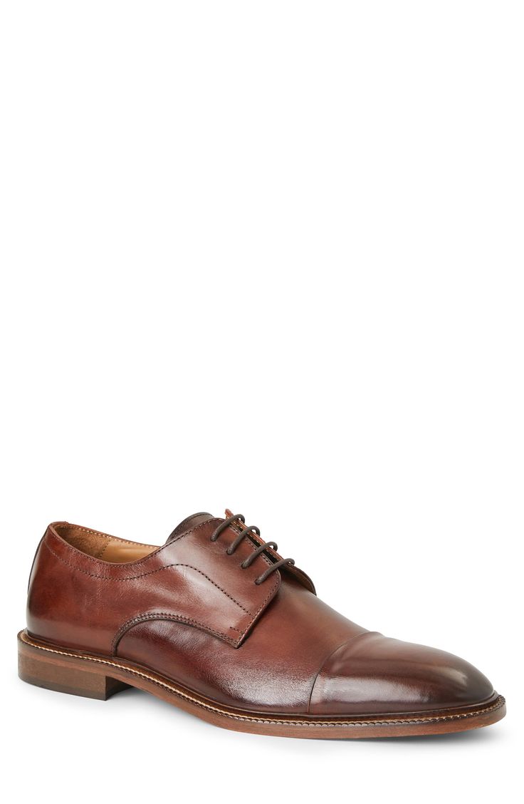 This cap-toe derby is cut from premium Italian leather. Lace-up style Leather upper and lining/leather and rubber sole Made in Italy Brown Goodyear Welted Lace-up Derby Shoes, Brown Cap Toe Goodyear Welted Lace-up Shoes, Brown Cap Toe Lace-up Shoes With Goodyear Welt, Brown Goodyear Welted Cap Toe Lace-up Shoes, Brown Goodyear Welted Cap Toe Leather Shoes, Brown Leather Sole Lace-up Shoes For Derby, Brown Lace-up Derby Shoes With Leather Sole, Brown Leather Sole Oxfords For Derby, Brown Cap Toe Oxfords For Derby