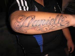 a man with a tattoo on his arm that says danielle in cursive writing