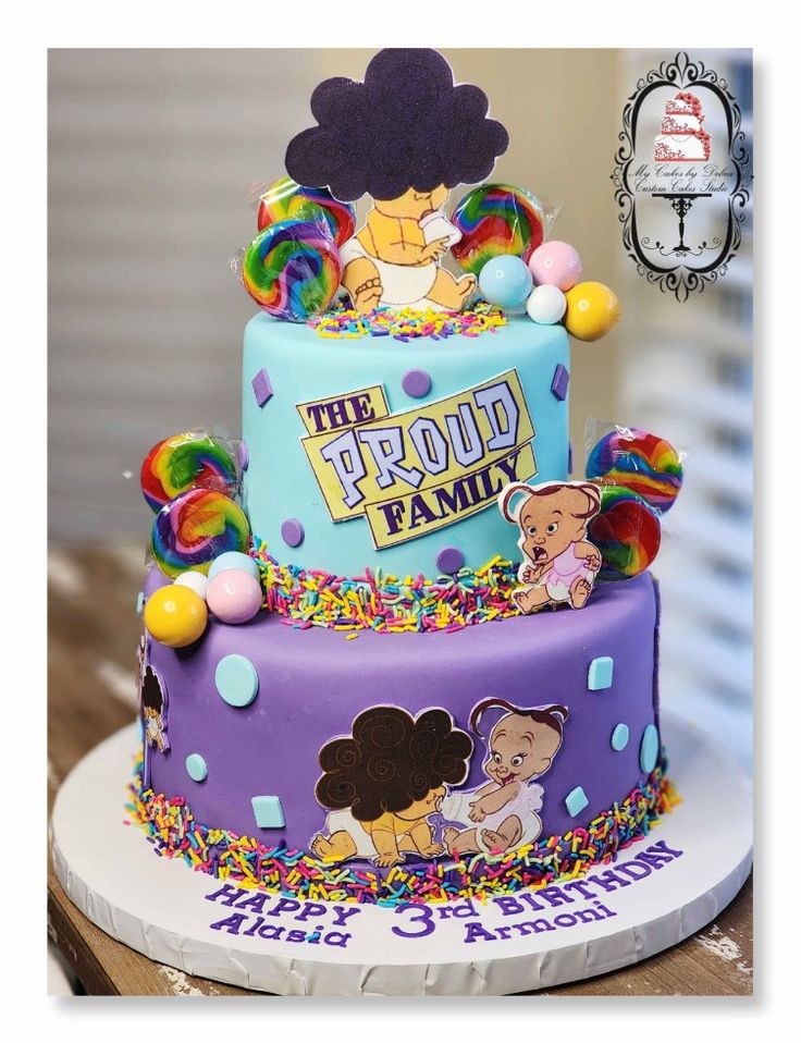 a multi - tiered cake decorated with cartoon characters and rainbow sprinkles