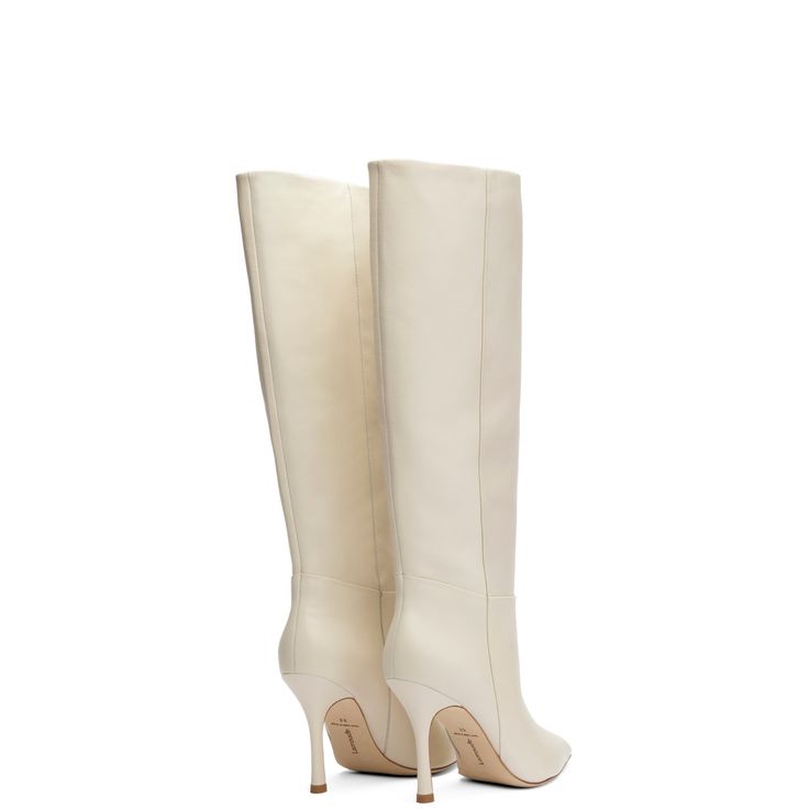 Crisp white boots feel particularly fresh right now and the Kate Boot in ivory kid leather is Larroudé's answer. Inspired by street style, this heeled, knee-high pair work with any color or look by showing the bright side of this must-have. Cream Knee-high Winter Boots, Winter Cream Knee-high Boots, Chic Cream Pointed Toe Knee-high Boots, White Wide Calf Knee-high Boots For Fall, Chic Cream Knee-high Boots With Pointed Toe, White Wide Calf High Heel Knee-high Boots, White Wide Calf Knee-high Boots With High Heel, White Wide Calf Knee-high Heeled Boots, White Wide Calf Knee-high Boots For Spring