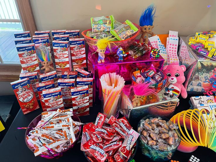 a table topped with lots of candy and candies