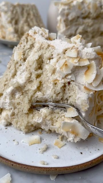 a piece of cake on a plate with a fork in it and another slice missing