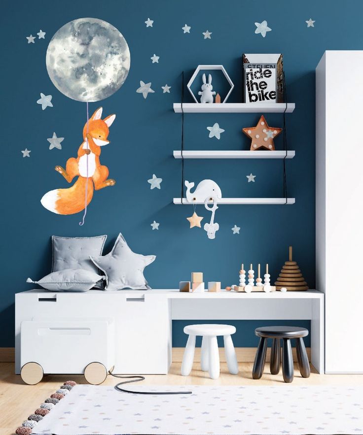 a child's bedroom decorated in blue and white with stars on the wall, a toy car next to it