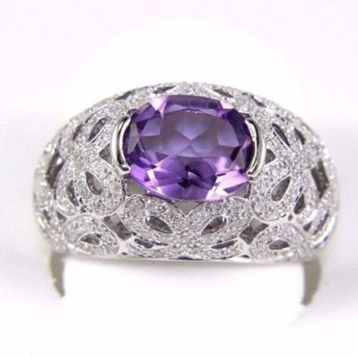 This Is A Fine Wide Oval Amethyst & Diamond Filigree Solitaire Ring. It Is Made Of 100% Natural 14kt White Gold And Is In Brand New Condition. It Has A Ctw Of 3.50ct (0.50 Diamond/3.00 Amethyst) And Weighs 7.7 Grams. The Fancy Diamonds Have A Clarity Of Si2 And H Color. This Beautiful Custom Piece Has An Excellent Wide Oval Cut Purple Amethyst Stone, Surrounded By Diamond Accents Along This Wide Dome-Shaped Ring. Samson Diamond Victorian Antiques, Amethyst And Diamond Ring, Fancy Diamonds, Amethyst Stone, Queen Anne, Purple Amethyst, Womens Jewelry Rings, Solitaire Ring, Oval Cut