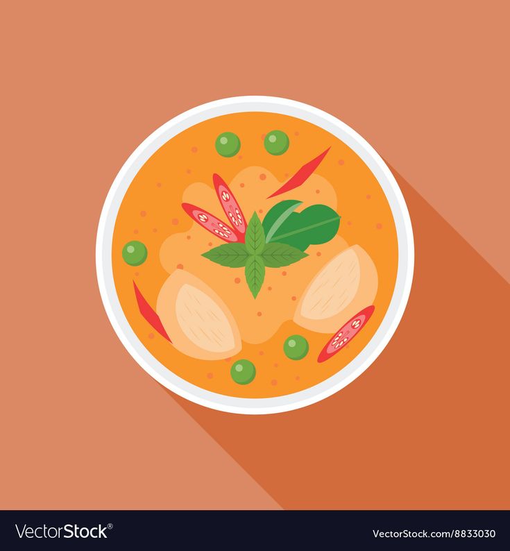 a bowl of soup with green beans and carrots on the table top view from above