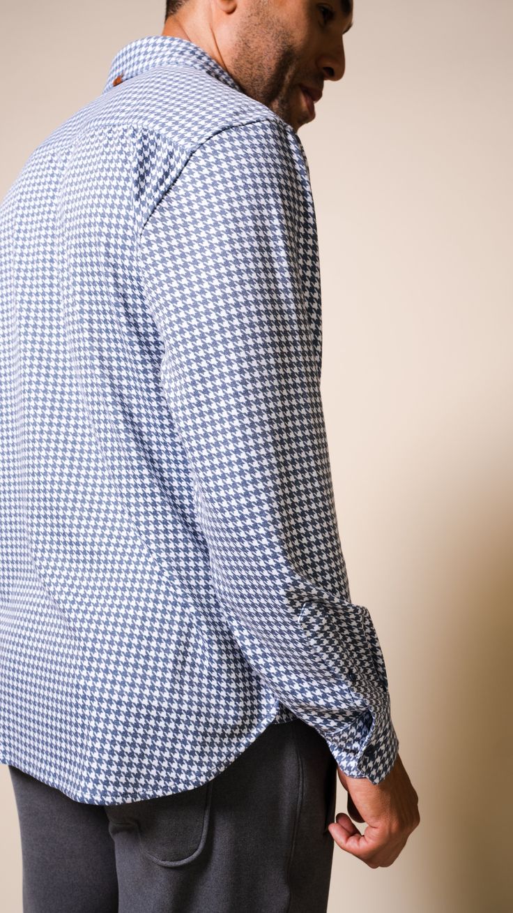 Now in a standout houndstooth pattern, the bestselling Andy Long Sleeve Shirt in Indigo boasts a cashmere-touch hand feel that gives an elevated take on your everyday shirt—a true chameleon no matter the vibe you’re going for. Layer up with your go-to outerwear or wear as is. Stylish plaid pattern Cashmere-touch fabric Double-sided brushed finish PRODUCT FEATURES Complementary color buttons Shirttail hem Leather icon label on placket and on back collar Golden neck seam piping with nylon inside b Long Sleeve Cotton Shirt With Houndstooth Pattern, Houndstooth Shirt For Workwear In Fall, Houndstooth Long Sleeve Shirt For Fall, Houndstooth Pattern Collared Shirt For Work, Collared Houndstooth Shirt For Work, Long Sleeve Houndstooth Shirt For Fall, Fall Houndstooth Shirt For Workwear, Long Sleeve Cotton Top With Houndstooth Pattern, Long Sleeve Houndstooth Shirt For Spring