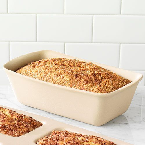 three pans filled with baked food sitting on top of a counter next to each other