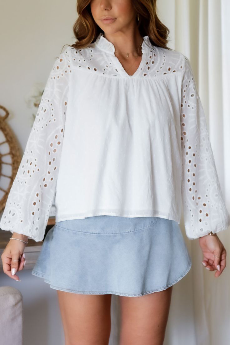 Add a touch of whimsy to your wardrobe with the Mandy Eyelet Blouse. Featuring delicate eyelet detailing, this blouse is sure to make you stand out. (Eyelet on point!) 65% Cotton 35% Polyester Color: White Long Sleeve Blouse All Over Eyelet Detail Light Weight Elastic Wrist Detail Double Lined in all the right placed Relaxed Flowy Style Ruffle Collar Detail Model is wearing a size Small. She is 5'6". 130lbs. Bust: 34" Waist 26" Hips 36" Chic Long Sleeve Tops With Broderie Anglaise, Broderie Anglaise Long Sleeve Blouse For Fall, Long Sleeve Broderie Anglaise Blouse For Fall, Elegant V-neck Blouse With Broderie Anglaise, Chic Cotton Blouse With Cutwork Hem, Fall Long Sleeve Broderie Anglaise Blouse, Spring V-neck Lace Top Blouse, V-neck Broderie Anglaise Top, V-neck Broderie Anglaise Blouse For Daywear