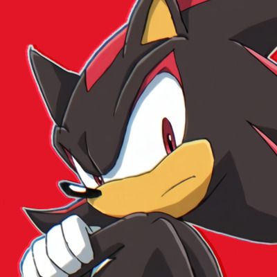 an animated image of a black and white sonic the hedge character holding his fist up