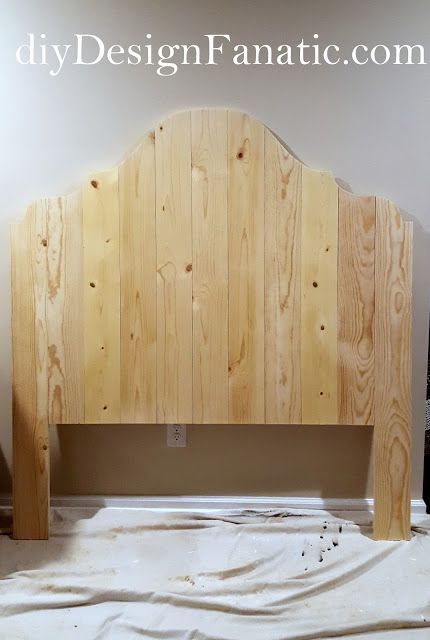 a bed frame made out of wooden planks