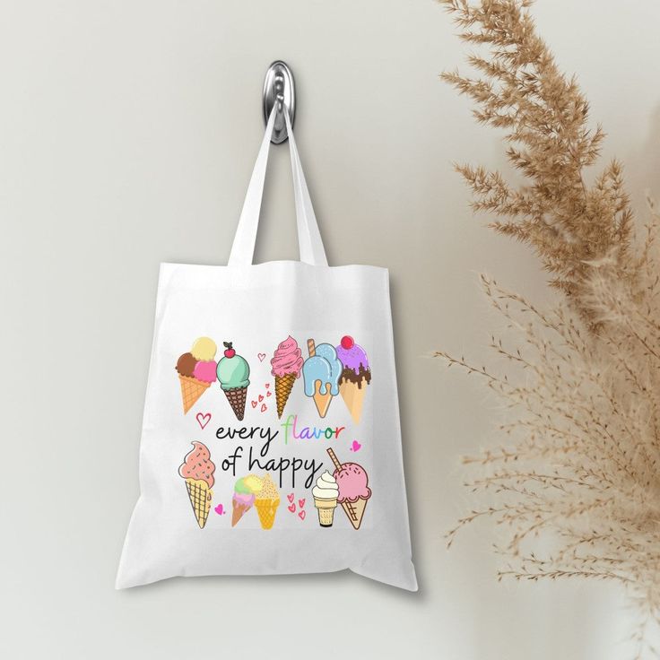 Show off your delicious style with this "Ice Cream Every Flavor of Happy 🍦🌈" tote bag! Featuring a colorful and playful design, this white tote will be your go-to for all of your summer fun - beach days, picnics, and summer travels! You'll be feeling "'scoops' of happiness" everywhere you go! 🍨 This bag is a perfect way to showcase a bit of your personality! It is practical, stylish and environmentally friendly reusable. We hand press each item with love and care. 💙▸ Dimensions are approxima White Canvas Bag For School Summer, Fun Summer School Bags, White Canvas Bag For Back To School, Trendy White School Canvas Bag, Fun Bags For Daily Use And Back To School, White Letter Print Bag For Back To School, Playful White School Bag, White Playful School Bags, Fun White Canvas Bag For Everyday Use