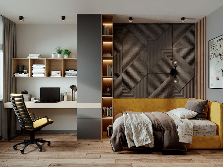 a bedroom with a bed, desk and chair next to a wall mounted bookcase