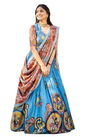 Blue attached cancan lehenga with hand painted kalamkari work. Paired with a floral hand painted padded blouse with glass beads embroidery and a co-ordinating dupatta. - Aza Fashions Blue Kalamkari Pre-draped Saree For Diwali, Half Saree Poses At Home, Wedding Dresses With Kalamkari Print, Transitional Season Blue Art Silk Lehenga, Floor-length Kalamkari Lehenga For Wedding, Wedding Pre-draped Kalamkari Print Saree, Wedding Pre-draped Kalamkari Print Semi-stitched Saree, Wedding Pre-draped Kalamkari Saree Semi-stitched, Floor-length Traditional Wear With Kalamkari Print For Wedding