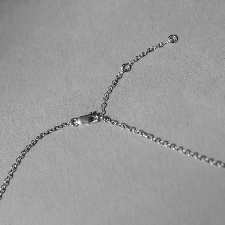 Hand hammered Sterling Silver V shaped pendant on sterling silver chain. 16"-18" adjustable. Model is wearing the gold-filled version. Everyday Silver Jewelry With Adjustable Length, Silver Teardrop Pendant Necklace With Cable Chain, Minimalist Adjustable Charm Necklace With Cable Chain, Sterling Silver Adjustable Initial Pendant Necklace, Sterling Silver Initial Pendant Chain Necklace, Silver Necklace With Adjustable Length For Everyday, Sterling Silver Necklace With Adjustable Length As Gift, Elegant Silver Hammered Charm Necklaces, Sterling Silver Jewelry With Adjustable Length For Everyday