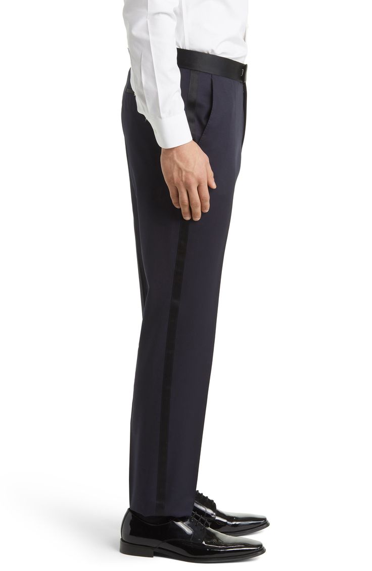 Perfected by a satin waist and trim, these dapper pants made from rich Italian virgin wool are a splendid way to complete your event ensembles. 100% virgin wool   Dry clean   Made in Turkey   Hugo Boss/BOSS/HUGO has received the Fair Labor Association accreditation, which signifies that the company has effective systems and procedures in place to successfully uphold fair labor standards throughout its supply chains, including strategies and tools to address and improve working conditions Classic Satin Trousers, Luxury Satin Trousers, Elegant Satin Tapered Leg Pants, Formal Classic Satin Bottoms, Classic Satin Formal Bottoms, Elegant Party Pants With Pressed Crease, Silk Trousers For Formal Occasions, Luxury Satin Pants For Formal Occasions, Luxury Satin Formal Pants