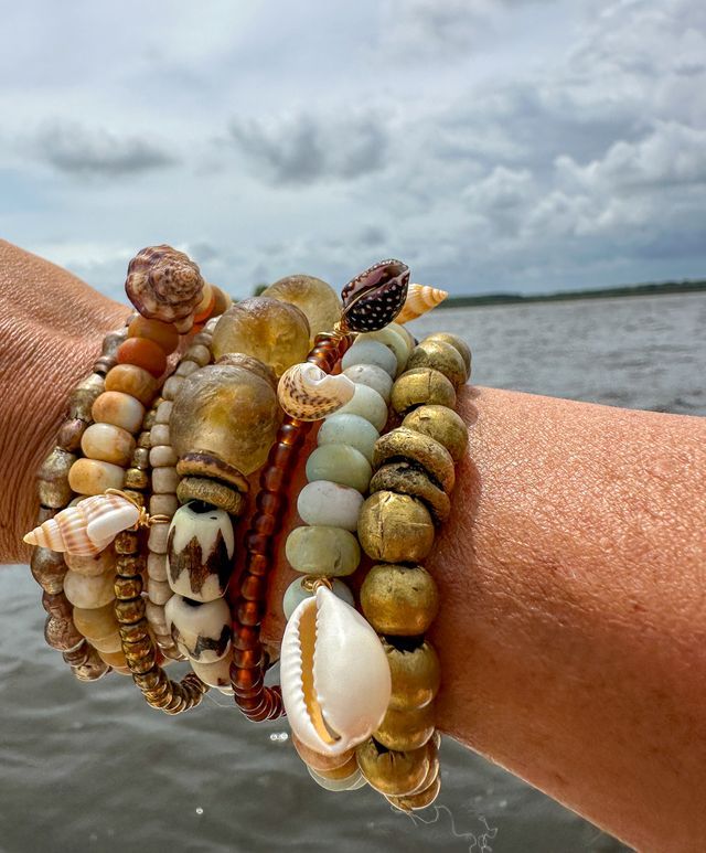 The Twine & Twig Tribal Stack is designed using globally sourced beads. They can be worn individually or stacked up. Fits wrist size 7". Bohemian Strand Jewelry With Cowrie Shell, Bohemian Cowrie Shell Beaded Bracelet For Summer, Bohemian Beaded Bracelets With Cowrie Shell, Stone Bracelets, Bohemian Beaded Cowrie Shell Bracelets, Bohemian Brown Shell Jewelry, Cowgirl Bracelets, Twine And Twig, African Beaded Bracelets