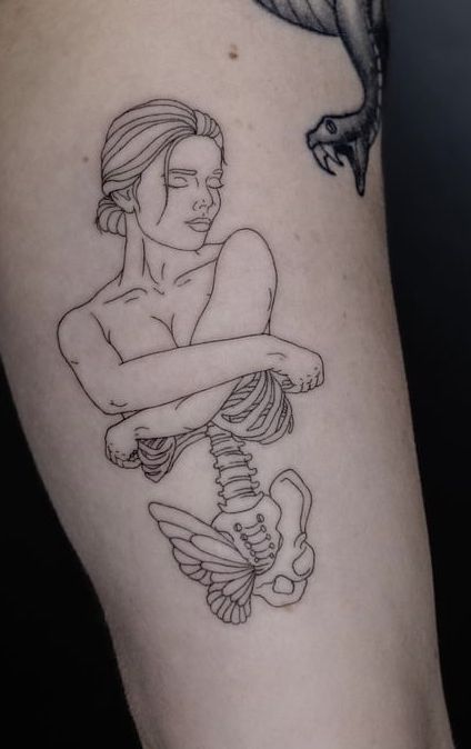 a tattoo with a woman holding a skeleton on it's arm and a bird flying over her shoulder