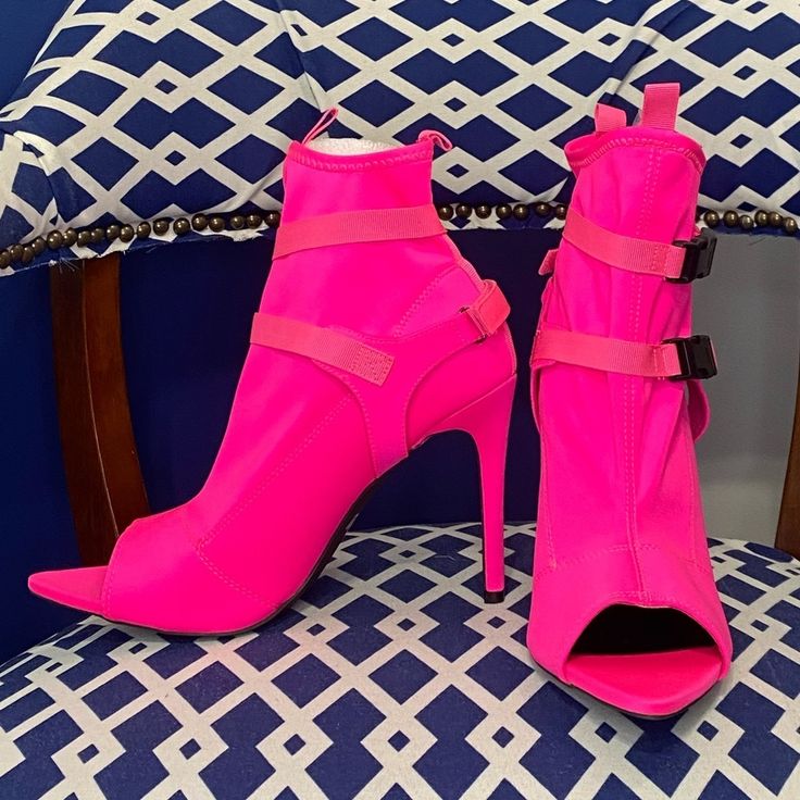 Neon Pink Pointy Peep Toe Ankle Bootie With Strap And Black Buckle Fasteners Across The Ankle. Made Of Stretchy Lycra Scuba Like Material. There Is One Light Spot On The Toe Area Noted In The Picture. Not Clearly Noticeable. Brand New(Tried On Once For Fit) Heel Height Approximately 4” True To Size Pink Ankle Booties For Spring, Fitted Ankle Boot Heels With Buckle Closure, Fitted Buckle Closure Ankle Boot Heels, Spring Party Pink Booties, Spring Party Ankle Strap Booties, High Heel Booties With Padded Ankle For Spring, Summer Party Booties With Pointed Toe, Fitted Closed Toe Spring Booties, Fitted Boots With Buckle Closure For Spring