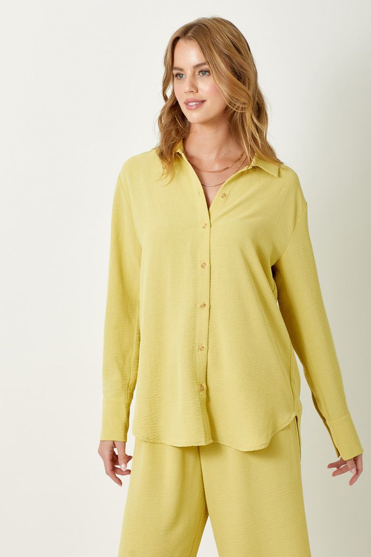 Add a touch of texture to your wardrobe with this playful Muted Lemon Button Down Blouse. With its unique textured design and classic button down style, you'll be a fashion standout. Whether dressing up for the office or dressing down for a day out, this shirt has you covered -100% Polyester -Model wears: S / Model height: 5` 9"