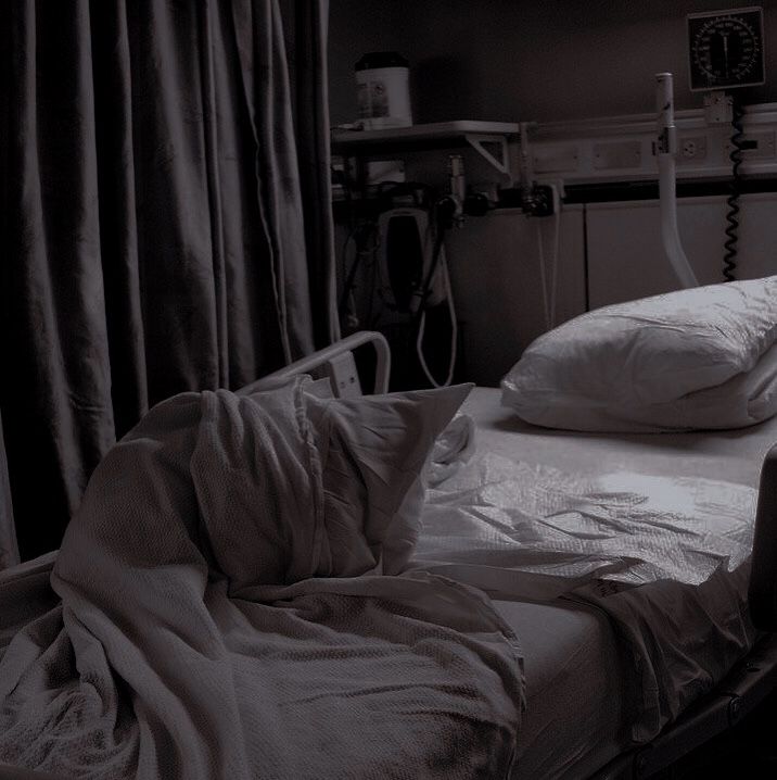 an unmade bed in a hospital room