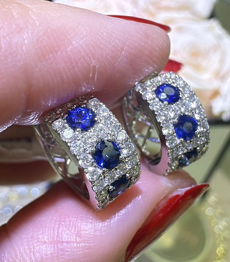 Indulge in luxury with our 1.26ct tw sapphire diamond wide pave huggie hoop earrings! These stunning earrings feature sparkling blue sapphires and diamonds, adding elegance and sophistication to any outfit. Elevate your style and let these earrings be a constant reminder of your impeccable taste. Metal: 18K White GoldBlue Sapphire: 6 Round-cuts 0.70ct twDiamond Weight: 56 Round-cuts 0.56ct tw Dimensions: W 6mm x L 12mm Necklace Guide, Diamond Initial Necklace, Jewelry Appraisal, Bridal Engagement Rings, Eternity Wedding Band, Jewelry Rings Diamond, Jewelry Repair, Stunning Earrings, Huggie Hoop Earrings