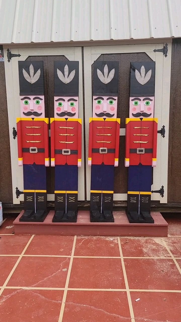 three nutcrackers made to look like soldiers